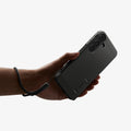 ACS11634 - Galaxy S26 FE Tough Armor (Mag Fit) showing Galaxy S26 FE Tough Armor MagFit case held in hand with wrist strap attached