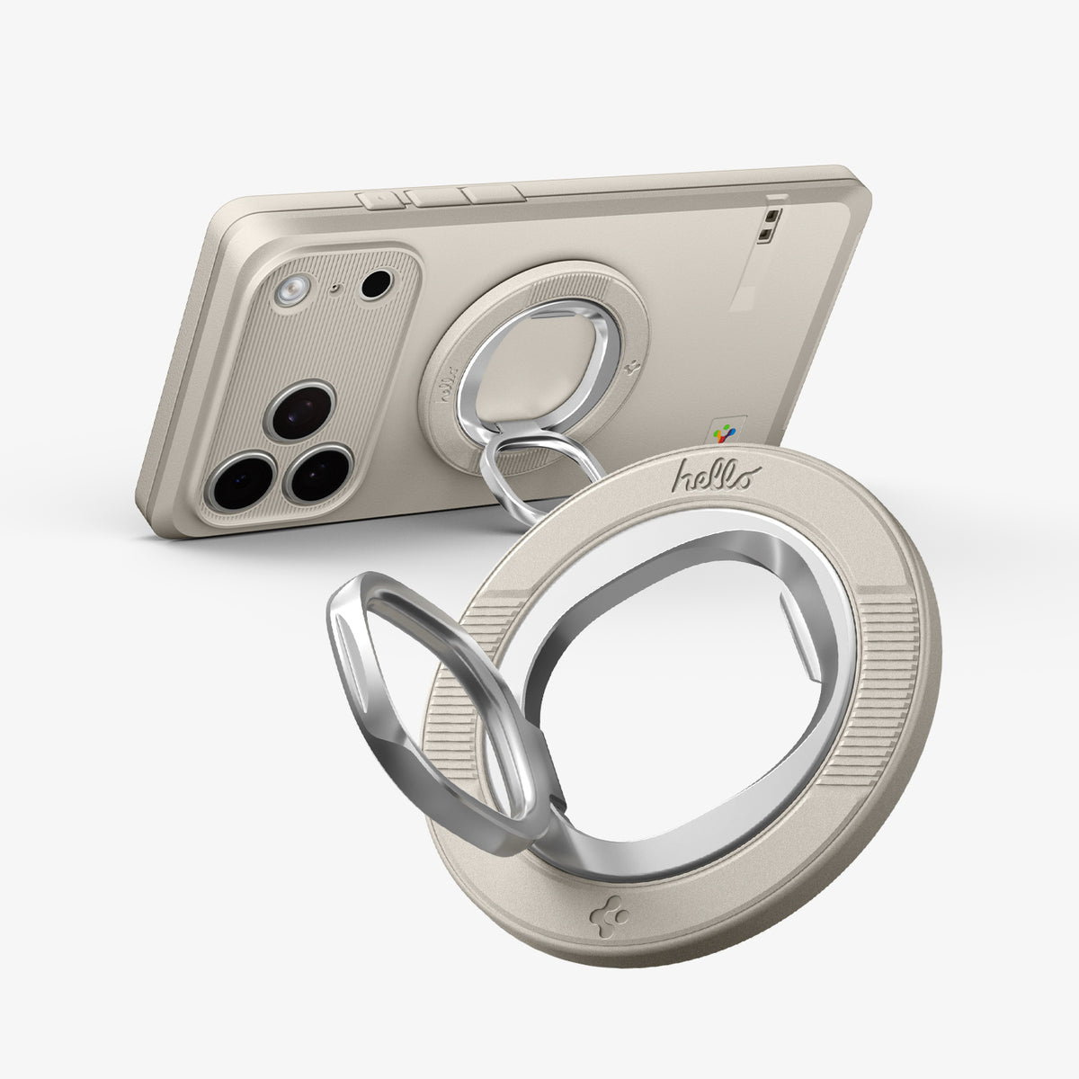 AMP11738 - Angled close-up of a phone with the Spigen Classic LS MagSafe ring propped up as a stand, with a second ring attachment shown separately in the foreground