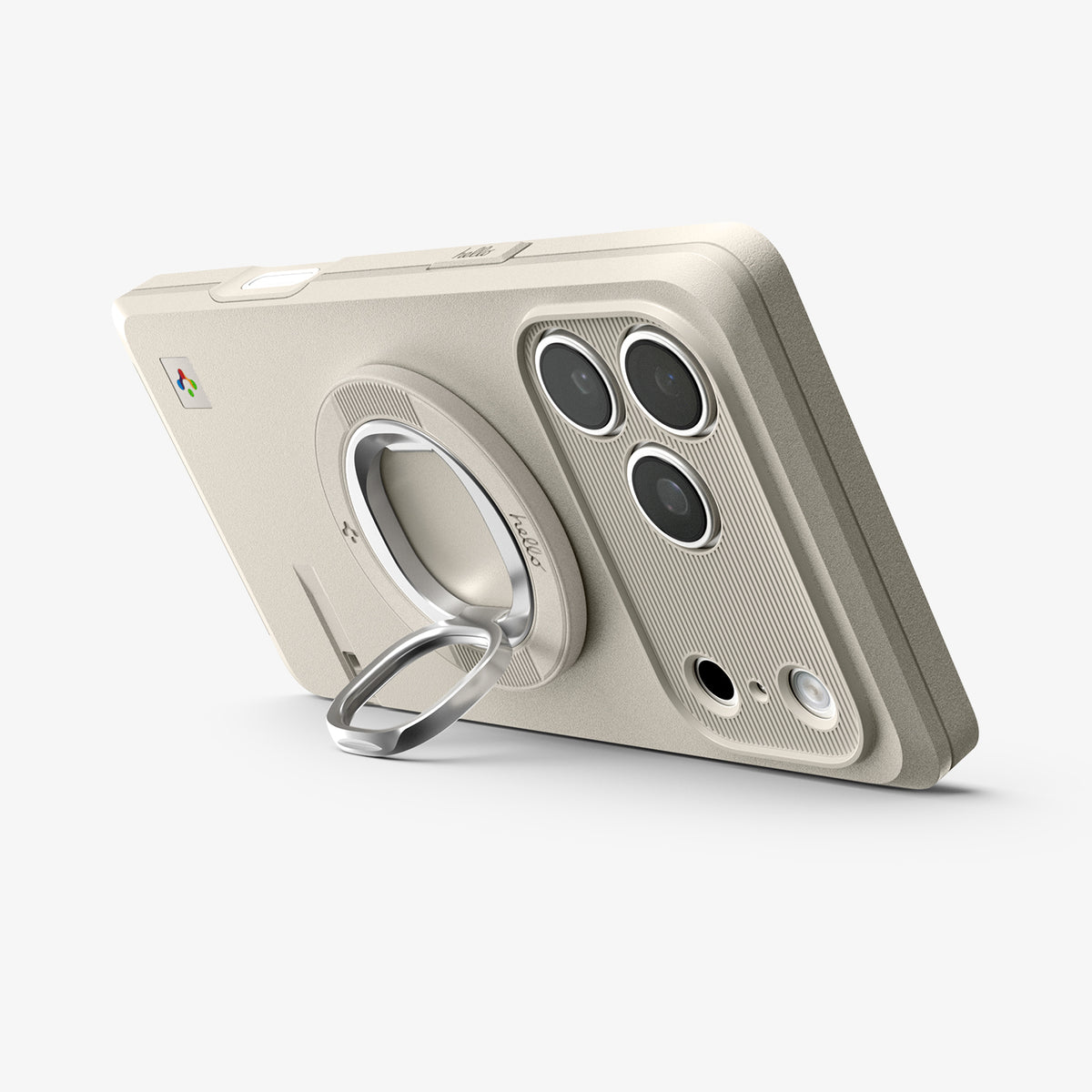 AMP11738 - Spigen Classic LS MagSafe ring attached to the back of a phone, propped up as a stand next to the camera