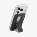 AFA11957 - Filp Stand Card Holder (Mag Fit) in Charcoal Stone showing a rear view of a phone supported by a foldable wallet kickstand