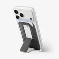 AFA11957 - Filp Stand Card Holder (Mag Fit) in Charcoal Stone showing a phone supported by an extended wallet kickstand with a card inserted