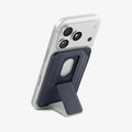AFA11956 - Filp Stand Card Holder (Mag Fit) in Navy Stone showing a rear view of a phone supported by a foldable wallet kickstand