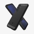 ACS08578 - Galaxy S24 FE Case Rugged Armor in Matte Black showing the back, partial side, behind is another device showing front and partial side