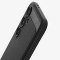 ACS08578 - Galaxy S24 FE Case Rugged Armor in Matte Black showing the back, partial side and bottom, half bodied, camera lens zoomed in