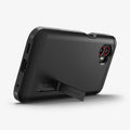 ACS09332 - Galaxy XCover 7 Pro Tough Armor Case in black showing the back, and bottom while propped up with the built-in kickstand