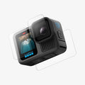 AGL09189 - HERO13 Black Glas.tR SLIM in Clear showing the lens screen protector hovering in from of the camera lens, showing the back, partial side and bottom of the device and partial screen protector hovering in the front