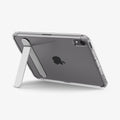 ACS11625 - Clear Spigen case with built-in kickstand extended, propping up an iPad Mini at an angle