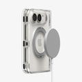 ACS11782 - iPhone Duo  Ultra Hybrid Pro S (Mag Fit) showing a folded phone in a clear case with a magnetic charger aligned with the metal ring on the back