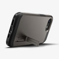 ACS09136 - iPhone 16e Case Tough Armor AI (MagFit) in Gunmetal showing the back, partial side and bottom with built-in kickstand propped up
