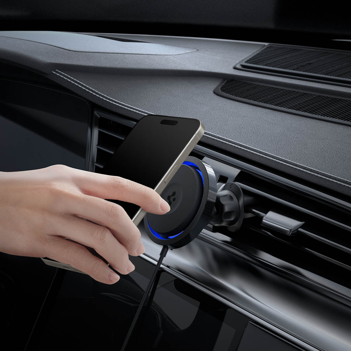 ACP07082 - OneTap Pro 3 CryoMax Air Vent Car Mount ITS12WC (MagFit) in Black showing a hand holding the device positioning in front of a car mount wireless charger