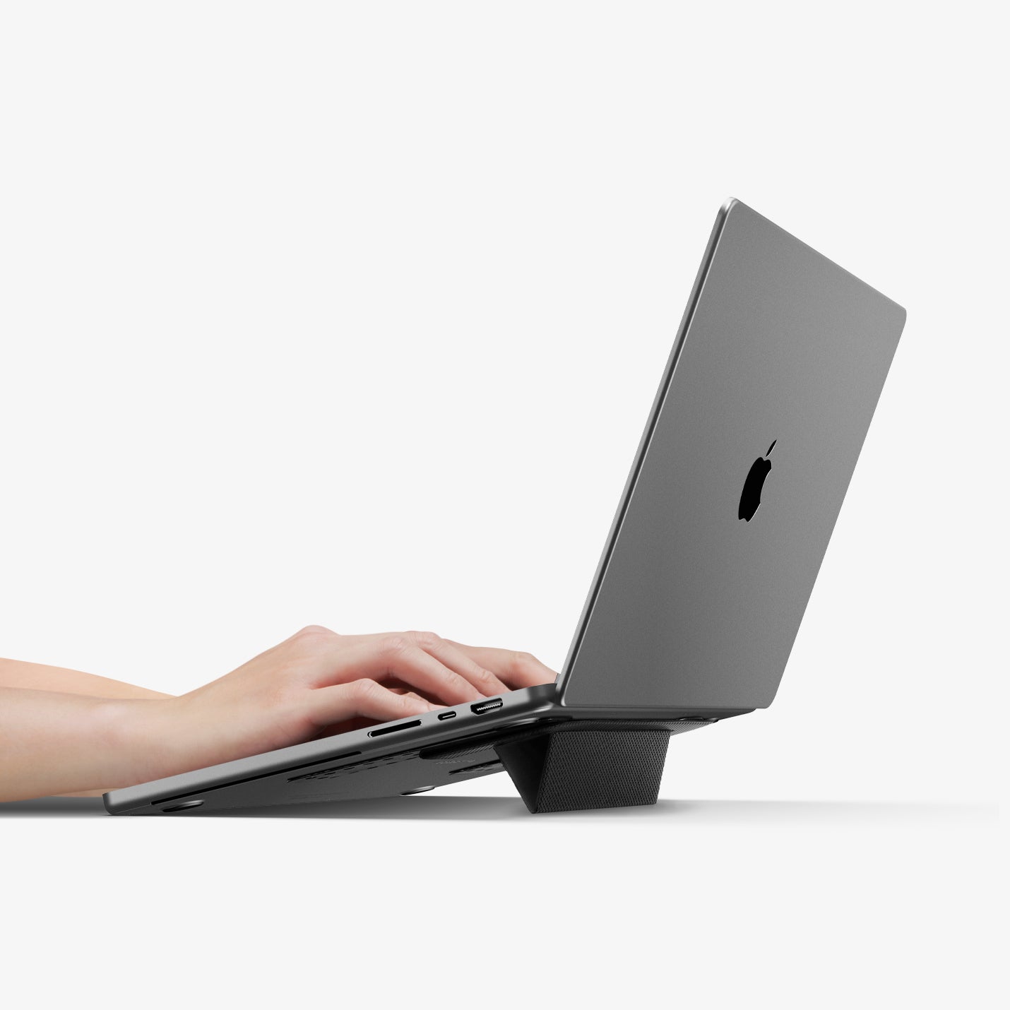AMP10401 - Slim Fold Laptop Stand | LD201-S1 showing someone typing on laptop with stand propped up