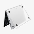 ACS11528 - MacBook Pro 14-inch Air Skin in Frost Clear showing the bottom exterior with four rubber feet and the Spigen logo visible on a white background