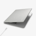ACS10974 - MacBook Air 13-inch in Heather Gray showing the top and side with laptop slightly open and charging cable next to port