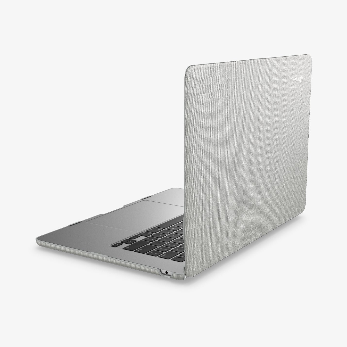 ACS10975 - MacBook Air 15-inch in Heather Gray showing the top and side with laptop slightly open and charging cable next to port