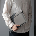 AFA06418 - Spigen Valentinus MacBook Sleeve held by person
