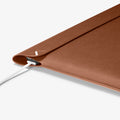 AFA06422 - Spigen Valentinus MacBook Sleeve side cutout design allowing laptop charging while inside sleeve