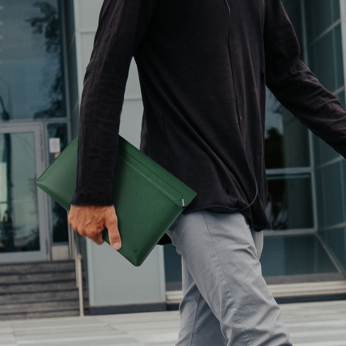 AFA06423 - MacBook Pro 14-inch Valentinus S Laptop Pouch in Jeju Green being carried by hand outdoors