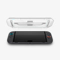 AGL09111 - Nintendo Switch 2 GLAS.tR EZ Fit in Clear showing the inner of the installation tray hovering above the device
