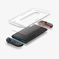 AGL09111 - Nintendo Switch 2 GLAS.tR EZ Fit in Clear showing the installation tray hovering above the screen protector and the device