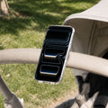 AMP11740 - Stroller Mount | OM200 (Mag Fit) showing a phone magnetically attached to a stroller handle using the adjustable strap mount