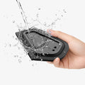ACP11829 - Water splashing over the Spigen car cleaning scraper held in hand, showing it's washable