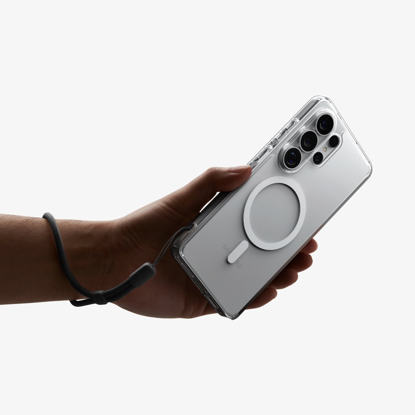 Spigen S26 Ultra Case Ultra Hybrid (Mag Fit) ACS10958 - Galaxy S26 Ultra Case Ultra Hybrid (Mag Fit) Crystal Clear showing a hand with strap on with the device and case