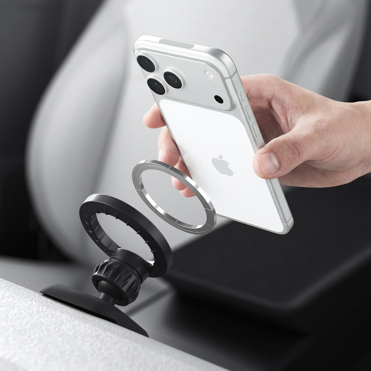 ACP10259 - Spigen Tesla Air Vent Dashboard Mount MagSafe alignment with iPhone approaching mount