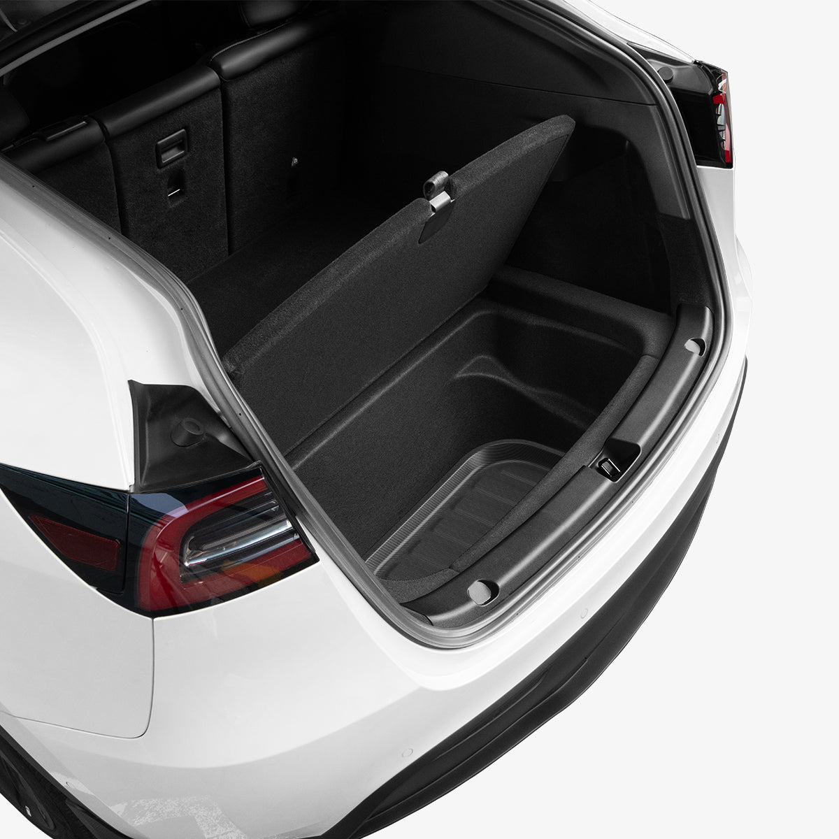 ACP06528 - Tesla Model Y Rear Trunk Storage Mat TL00-Y in Black showing the partial front inside a car's trunk