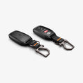 ACS11366 - Toyota Key Fob Cover | TK100 showing two key fob covers side by side with Toyota key fob inserted in one and carabiner attached