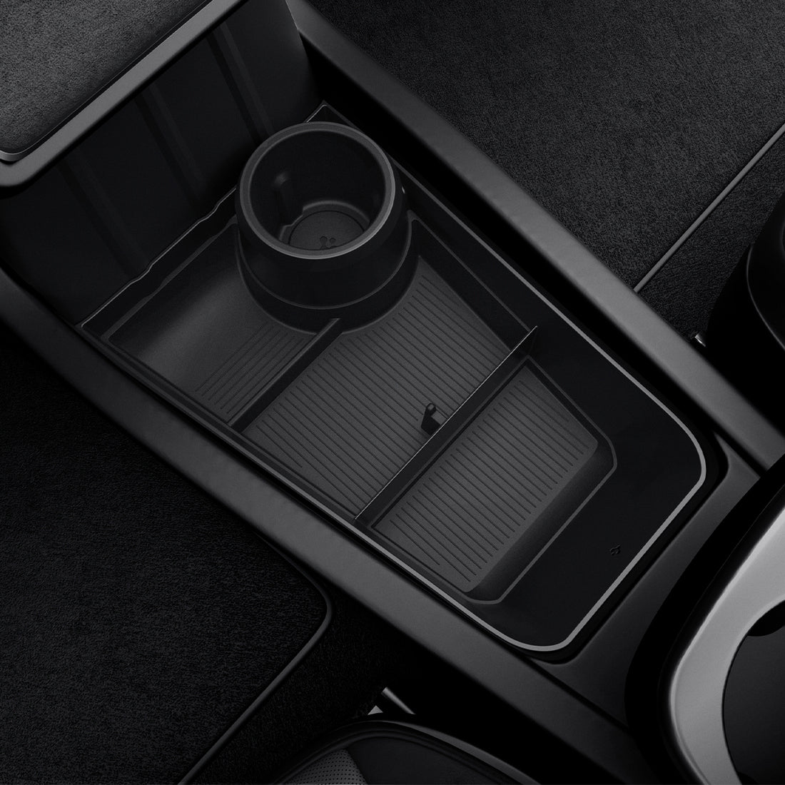 ACP11169 - Tesla Series - Center Console Organizer Lower Tray | TO220LYS in Black showing divided storage compartments with integrated cup holder and non-slip textured base installed in the center console.