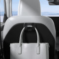 ACP11563 - Model Y Premium (2025+) in Black showing a seatback-mounted hook holding a handbag securely behind the front seat.