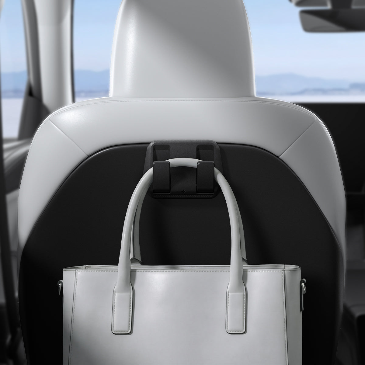 ACP11563 - Model Y Premium (2025+) in Black showing a seatback-mounted hook holding a handbag securely behind the front seat.