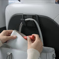 ACP11563 - Model Y Premium (2025+) in Black showing a seatback hook holding a handbag while allowing easy access to items inside.