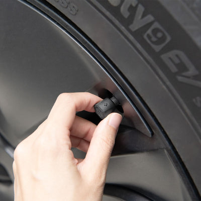 ACP09331 - Tesla Series Valve Stem Cover VS100 showing hand to control product