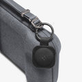 AGP09835 - Klasden Gaming Pouch 7 inch in Charcoal Gray showing the keychain with the Spigen logo