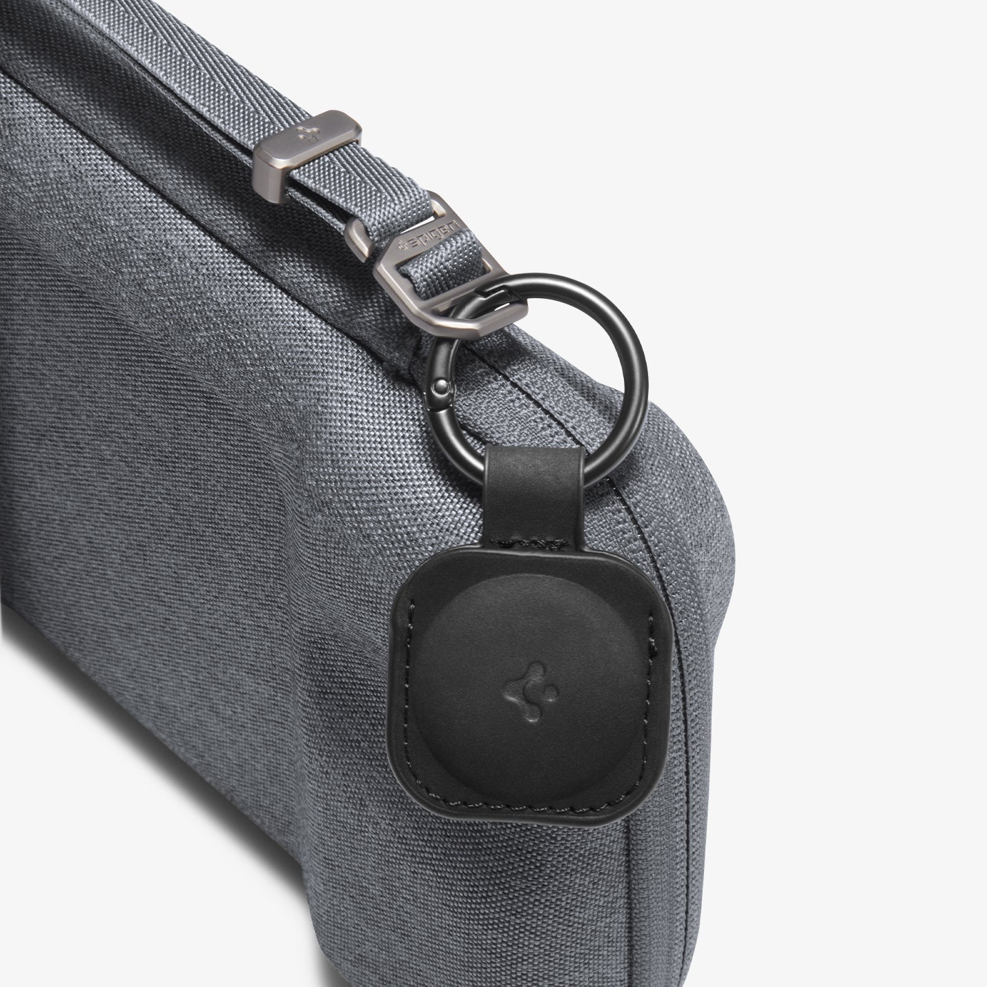 AGP09835 - Klasden Gaming Pouch 7 inch in Charcoal Gray showing the keychain with the Spigen logo
