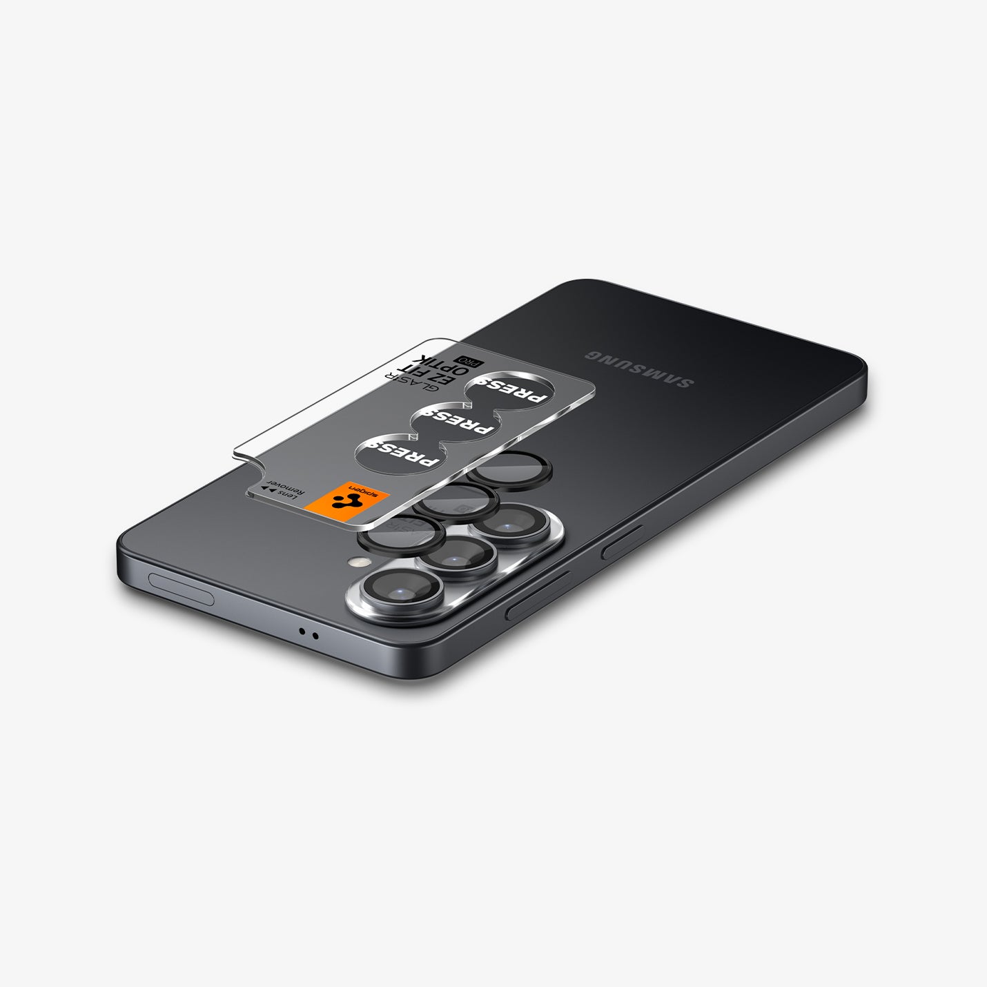 AGL11082 - Galaxy S26 Plus Optik EZ Fit Lens Pro Protector showing the lens protector tray hovering above the lens protector and the device