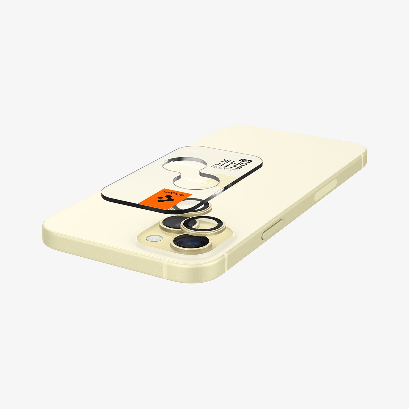 AGL07168 - iPhone 15 Plus Optik Pro EZ Fit Lens Protector in Yellow showing the optic tray hovering above the lens and the device showing back and partial side