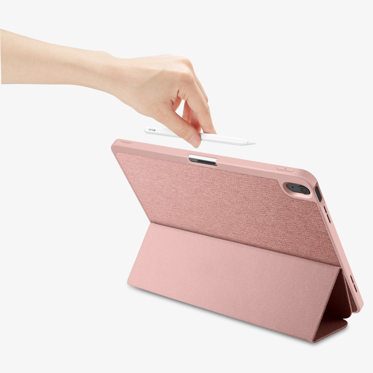 ACS07673 - iPad Air 12.9-inch Case Urban Fit in Rose Gold showing the back, with a folded front cover propped up as a stand while a hand holding a stylus pen