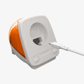 AMP09342 - Apple Watch Classic C1 Charger Stand in tangerine showing case with charging cable.