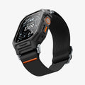 ACS11415 - Three-quarter front view of Spigen Lite Fit Pro Apple Watch Ultra case in black with orange stitched nylon band and Digital Crown accent
