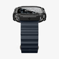 ACS11414 - Front view of Spigen Rugged Armor case on Apple Watch Ultra showing Shock Resist bezel engraving and black Band