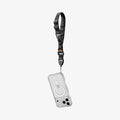 AFA10615 - The Wrist Lanyard | DA30S, shown attached to a clear MagSafe phone case with a quick-release buckle, is displayed on a white background. Order now for expedited shipping and fast delivery.