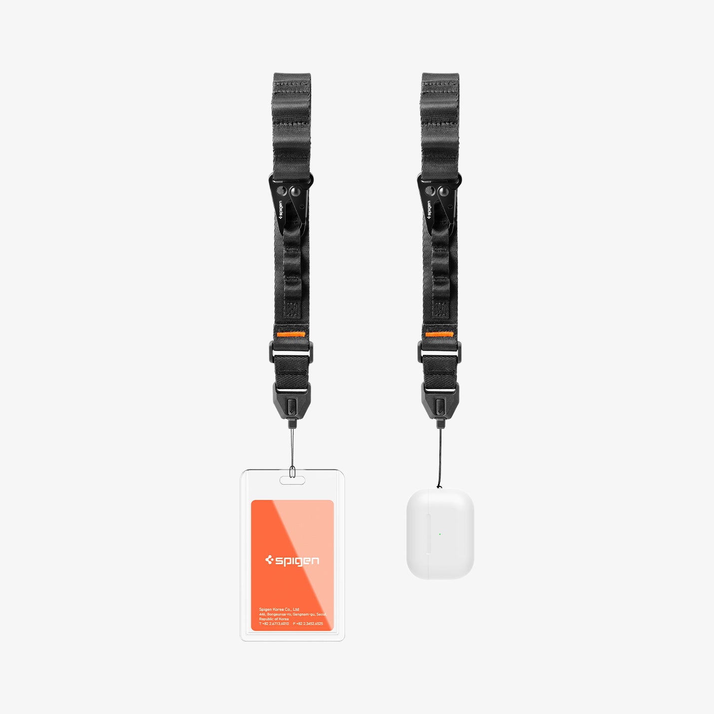 AFA10615 - Two black Wrist Lanyard | DA30S with clips—one holding a clear ID badge with an orange Spigen card, the other a white wireless earbud case—are shown on a plain light background, ideal for carrying rewards or seasonal coupon cards.