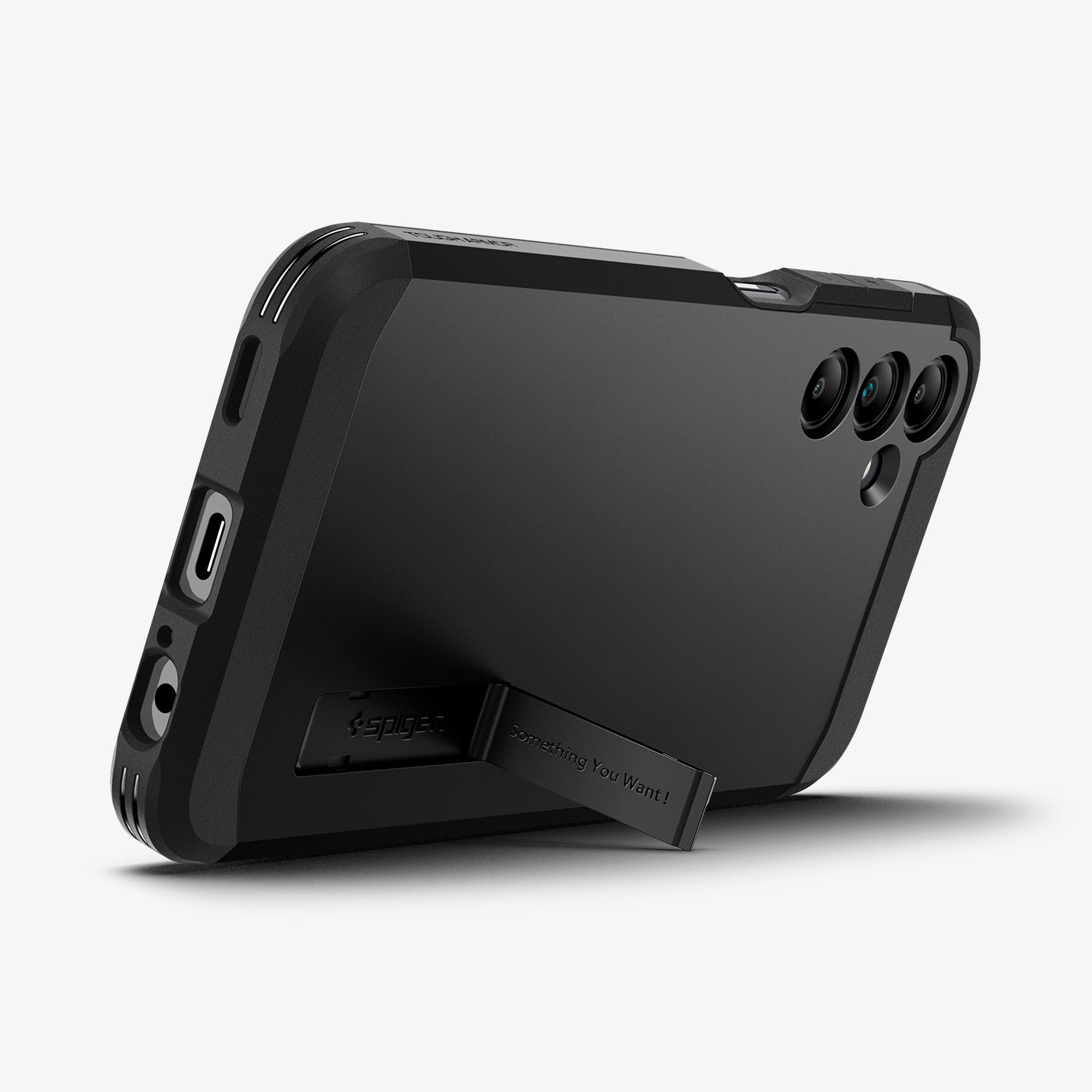 ACS07242 - Galaxy A15 5G Case Tough Armor in Black showing the back, partial side and bottom with a built-in kickstand propped up
