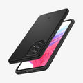 ACS04257 - Galaxy A53 5G Case Thin Fit in Black showing the back, partial side and top hovering in front of a device showing partial front, side and bottom