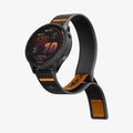 AMP11425 - Gamin 22mm Athlex Air Quick Realase showing angled front display of smartwatch with adjustable Athlex Air 2 Quick Release 22mm woven band in black and orange