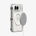  ACS11688 - iPhone Duo Ultra Hybrid Pro (Mag Fit) in Clear White showing a folded phone case with a magnetic charger positioned near the magnetic ring on the back