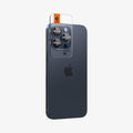 AGL07164 - iPhone 15 Pro / 15 Pro Max Optik Pro Lens Protector in blue titanium showing the back and side with ez fit tray installed onto camera lens