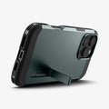 ACS08148 - iPhone 16 Pro Case Tough Armor AI (MagFit) in Abyss Green showing the back, partial side and bottom with built-in kickstand propped up